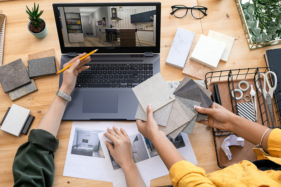 Contemporary,designer,pointing,at,home,interior,example,on,laptop,display