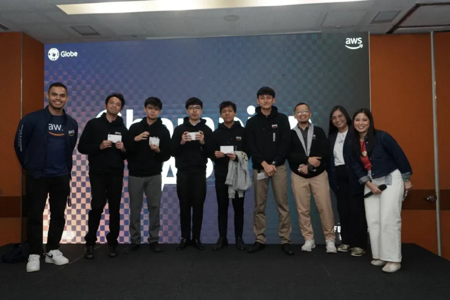 [L-R] AWS Sr. Solutions Architect and event host Francis Valbuena; Globe x AWS Party Rock champions from Asia Pacific College Jacob Angelo De Villa, Brylle Ace M. Nuñez, Danziel Cempron, Michael Vinz Tapiru, and Janson Crisostomo Pagharion; Globe Strategic Analytics Manager Titus Jungao; Globe Solutions Architect Sr. Manager Rhea Lucas; and Globe Data Operations Expert and event host Kit Dela Rosa.